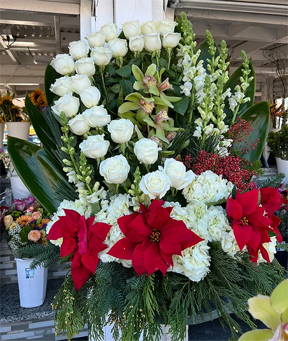 Poinsettia and White Rose Arrangement